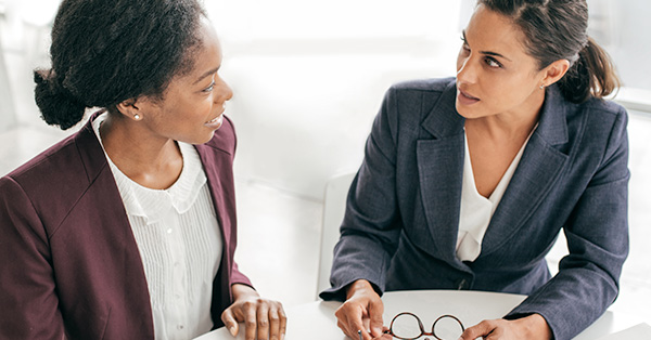 two professional women chat